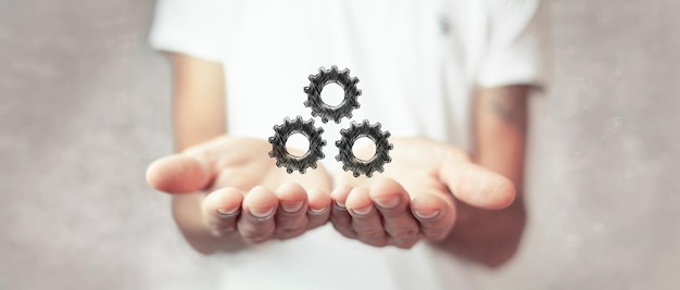 Hand-drawn gears. man holding open palms