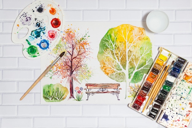 Hand Drawn Sketch of Autumn Park trees With Paints concept of human creativity top flat view