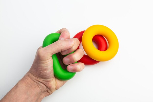 Photo hand expander in the form of colored rubber rings of different density