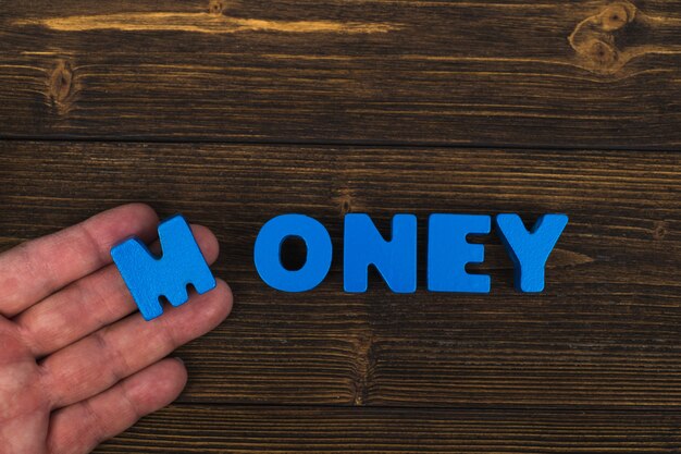 Hand and finger arrange text letters of MONEY word