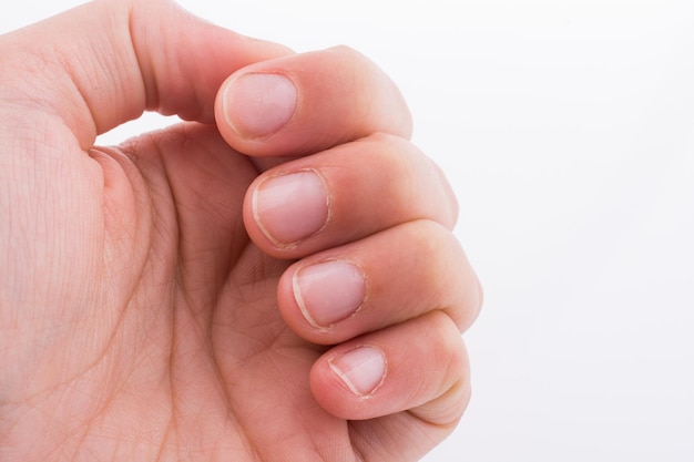 Hand fingers and fingernails on a white background