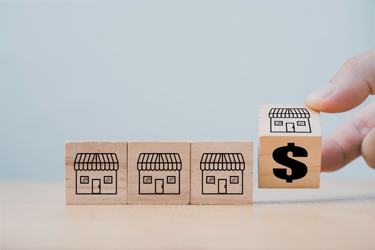 Hand flipping wooden cube block for change franchise store to dollar  sign , Expand franchise development concept.
