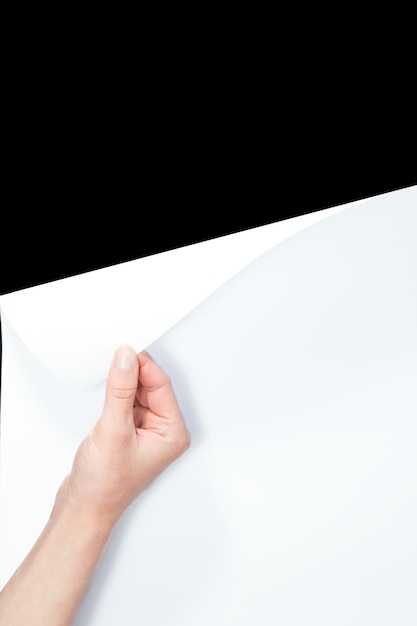 A Hand flips a sheet of paper presentation office