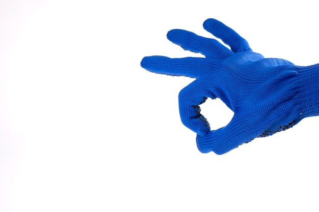 Photo hand gesture. hand ok on a white background. gesture ok. hand in construction glove