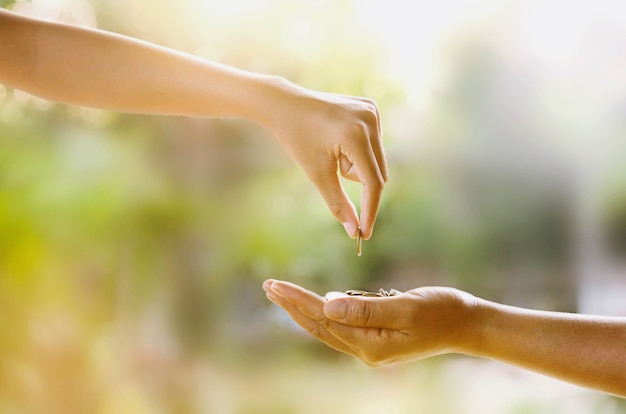 Photo hand giving money for investment the future