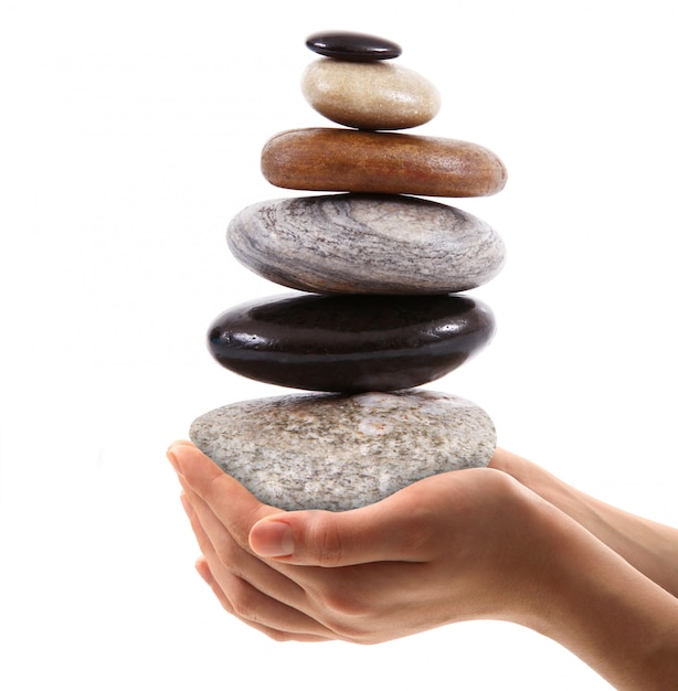 Hand held stones on white