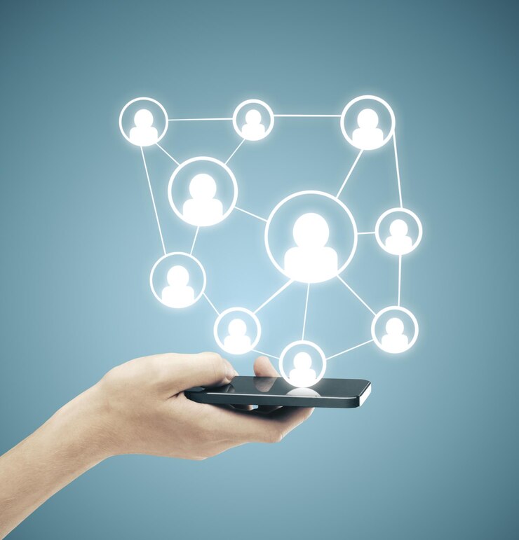 Hand hodling phone with social media plan