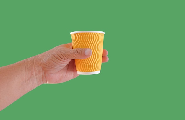 Hand hold a hot drink in to go paper cup