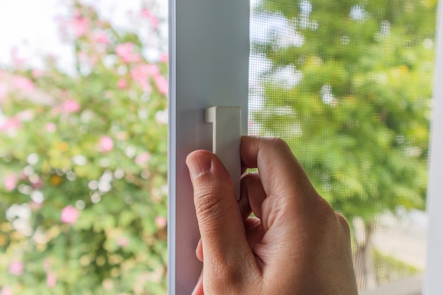 Hand hold mosquito net wire screen handle on house window