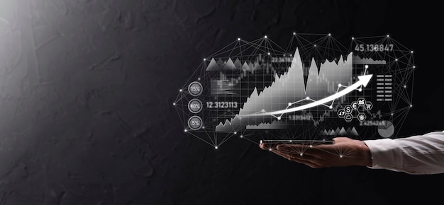 Hand hold sales data and economic growth graph chart. business planning and strategy. analysing trading of exchange. financial and banking. technology digital marketing.profit and growing plan