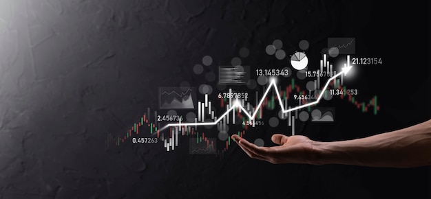 Hand hold sales data and economic growth graph chart. Business planning and strategy. Analysing trading of exchange. Financial and banking. Technology digital marketing.Profit and growing plan.