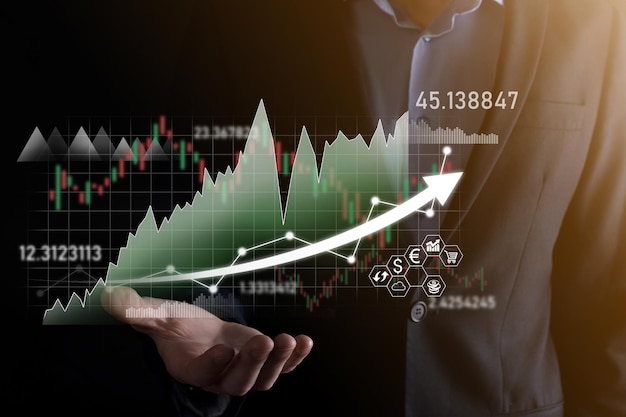 Hand hold sales data and economic growth graph chart. Business planning and strategy. Analysing trading of exchange. Financial and banking. Technology digital marketing.Profit and growing plan.