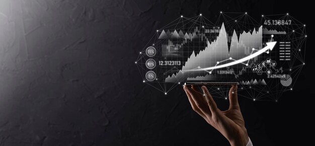 Hand hold sales data and economic growth graph chart. Business planning and strategy. Analysing trading of exchange. Financial and banking. Technology digital marketing.Profit and growing plan.