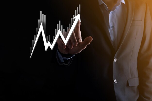 Hand hold sales data and economic growth graph chart. Business planning and strategy. Analysing trading of exchange. Financial and banking. Technology digital marketing.Profit and growing plan.