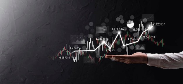 Hand hold sales data and economic growth graph chart. Business planning and strategy. Analysing trading of exchange. Financial and banking. Technology digital marketing.Profit and growing plan.