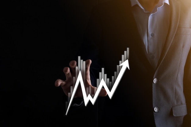 Hand hold sales data and economic growth graph chart. Business planning and strategy. Analysing trading of exchange. Financial and banking. Technology digital marketing.Profit and growing plan.