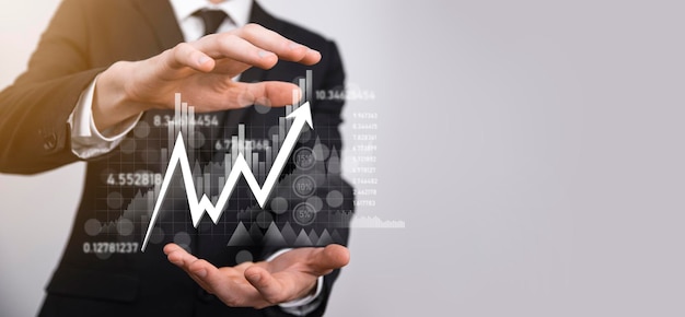 Hand hold sales data and economic growth graph chart. Business planning and strategy. Analysing trading of exchange. Financial and banking. Technology digital marketing.Profit and growing plan.