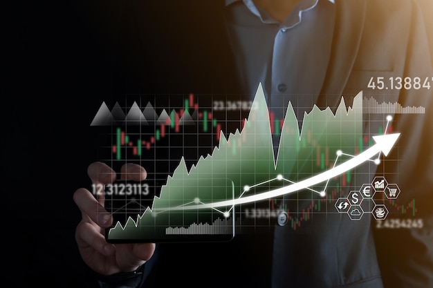 Tenere in mano i dati di vendita e il grafico della crescita economica pianificazione e strategia aziendale analisi del trading di borsa tecnologia finanziaria e bancaria marketing digitaleprofitto e piano di crescita