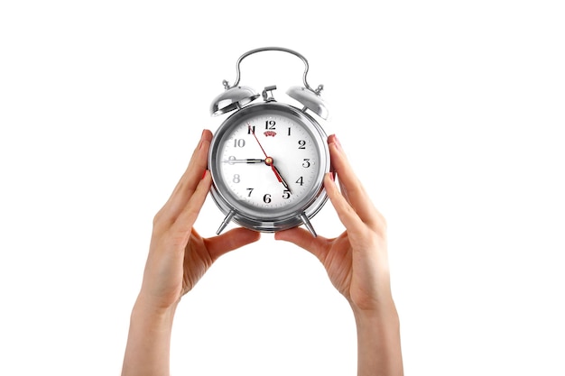 hand holding alarm clock on a white background