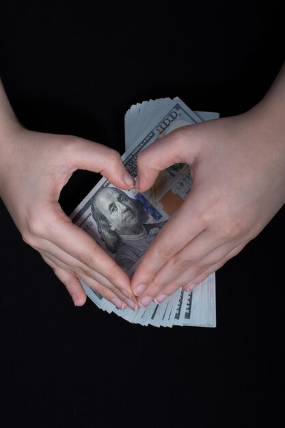 Hand holding American dollar isolated on white background