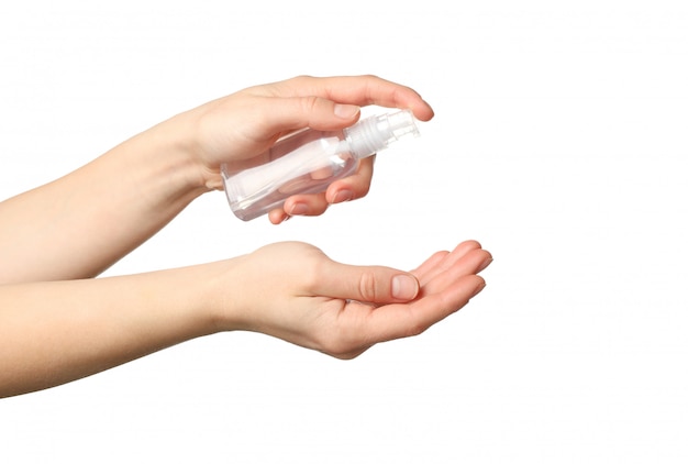 Hand holding antiseptic antibacterial disinfectant isolated on white.