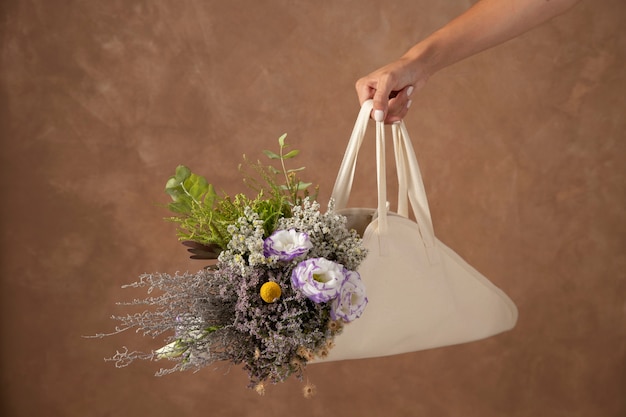 Hand holding beautiful flowers bouquet