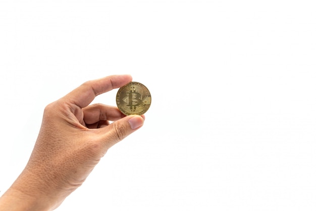 Hand holding bitcoin on white