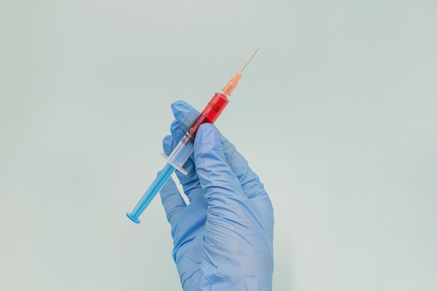 Hand holding Bloodtest syringe