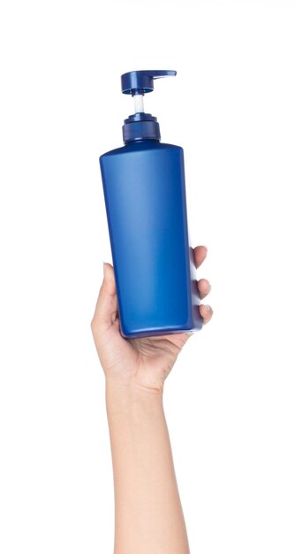 A hand holding blue of bottle shampoo isolated on white background