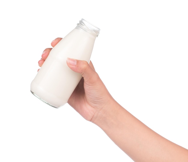 사진 흰색 배경에 고립 된 우유 병을 들고 손