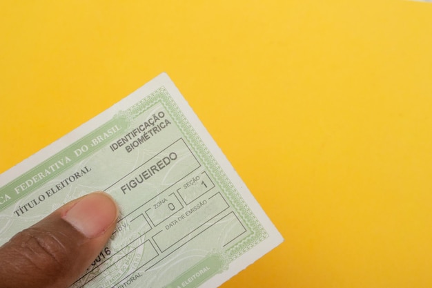 Hand holding brazilian election document