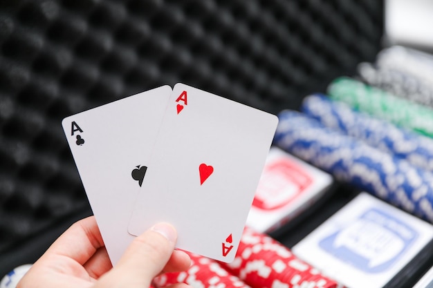 a hand holding a card that says playing cards.