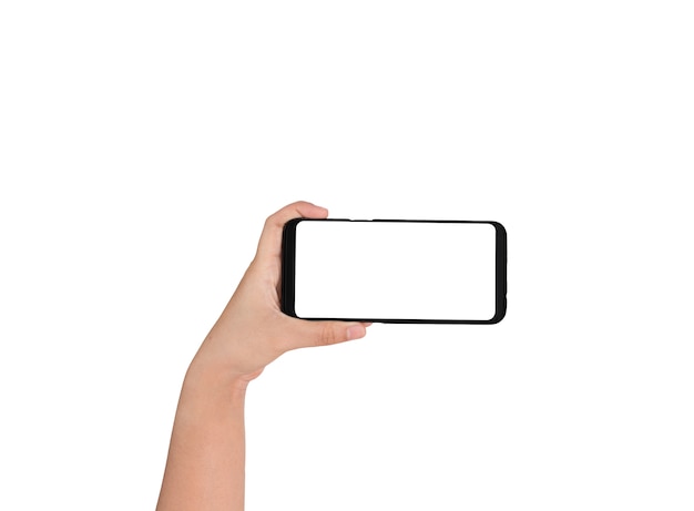白い画面と白い背景に手を持っている携帯電話の手