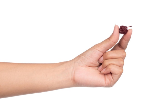 Photo hand holding cherry dried isolated on white background