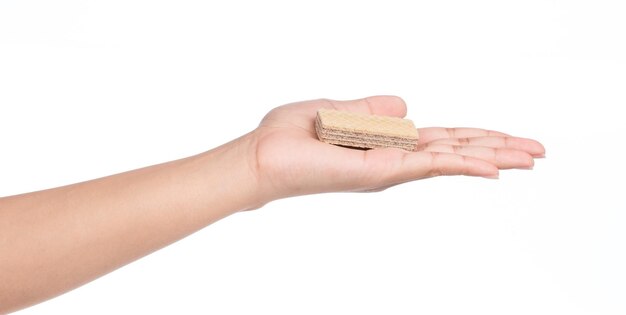 hand holding chocolate waffles isolated on white background