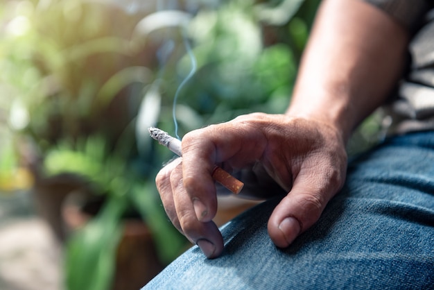 Hand holding cigarette