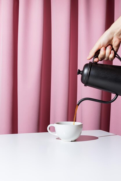 Photo hand holding coffee cup