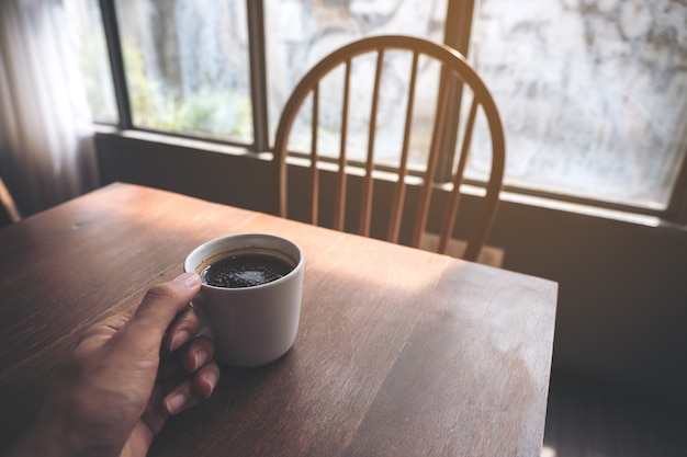 hand holding coffee cup