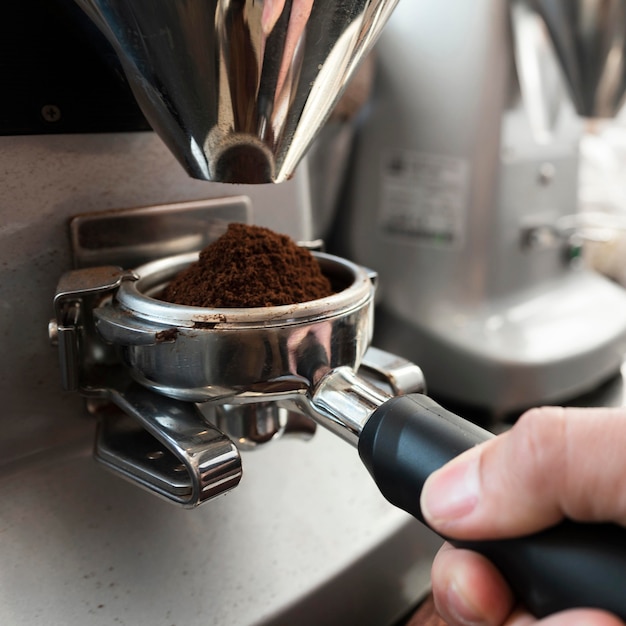 Photo hand holding coffee making tool close up