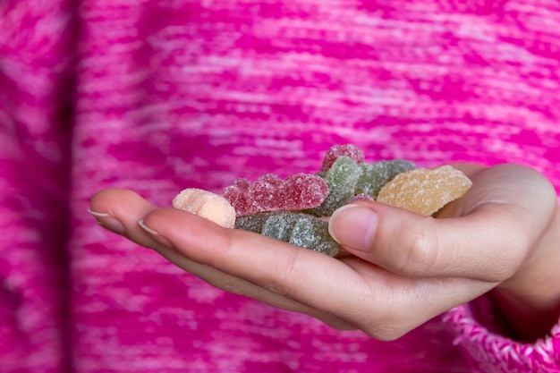 Hand holding colorful candies