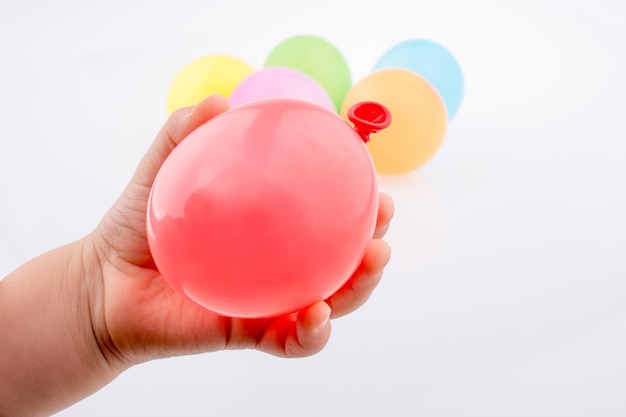 Hand holding a Colorful small balloon in hand