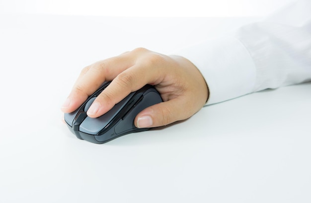 Photo hand holding computer wireless mouse isolated