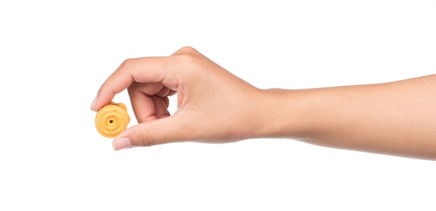 Photo hand holding cookie isolated on white background