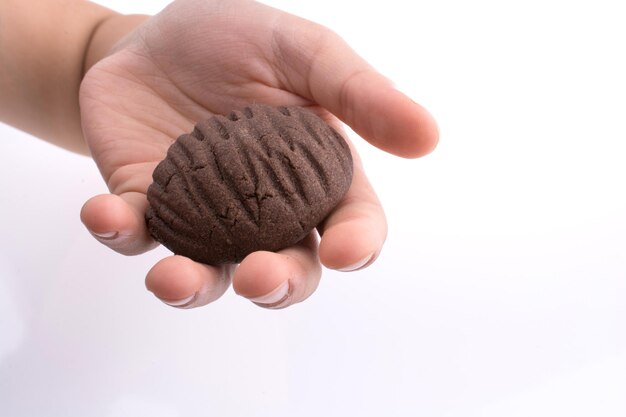 Hand holding a cookie