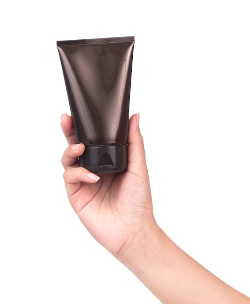 hand holding Cosmetic black plastic tube isolated on white background.