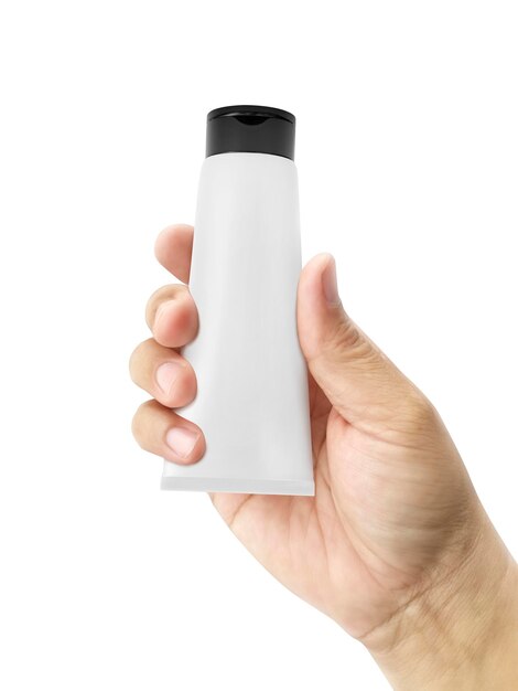 Photo hand holding cosmetic plastic tube isolated on white background