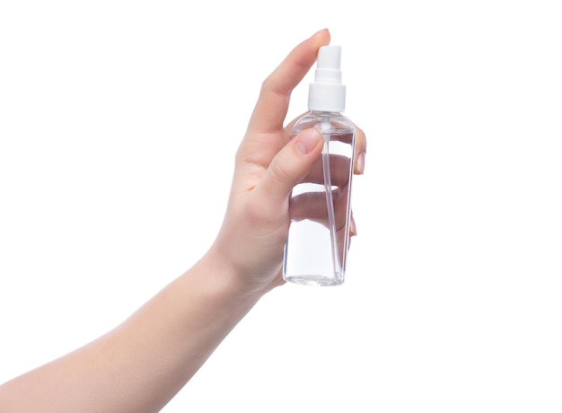 Hand holding cosmetics bottle on white background