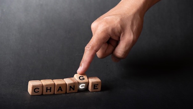 Hand holding dice with text for illustration of chance and
change words