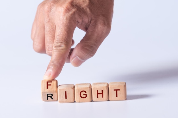 hand holding dice with text for illustration of FIGHT your RIGHT words