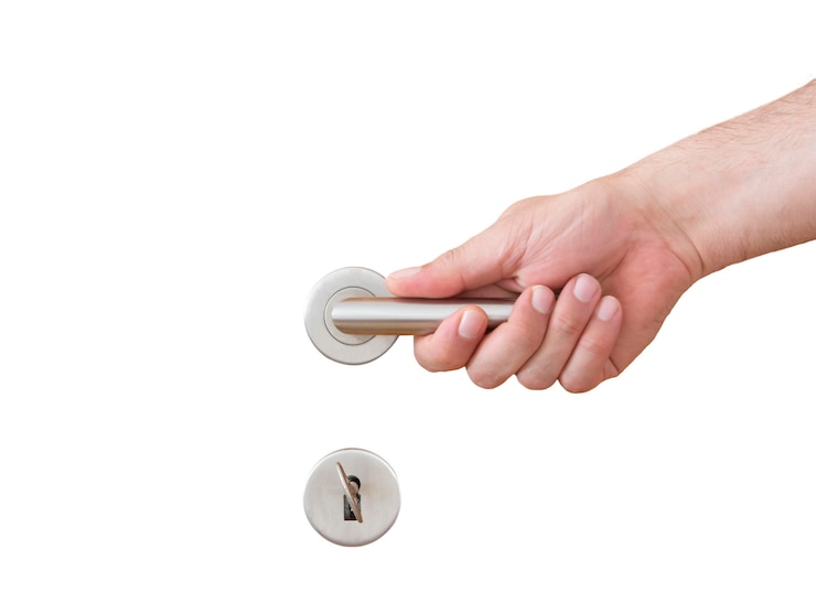 Photo hand holding a door handle